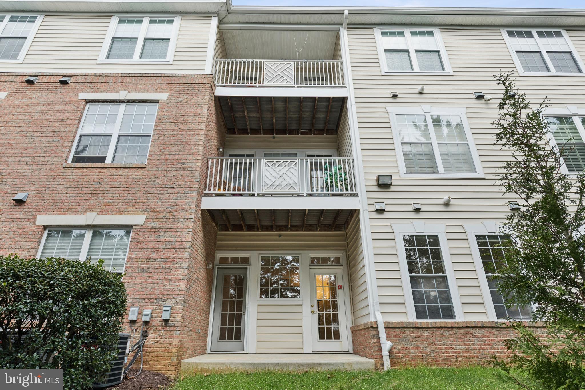 431 Hamlet Club Drive, Unit 102 Edgewater, MD 21037 - Photo 39 of 55 a front view of a house with plants
