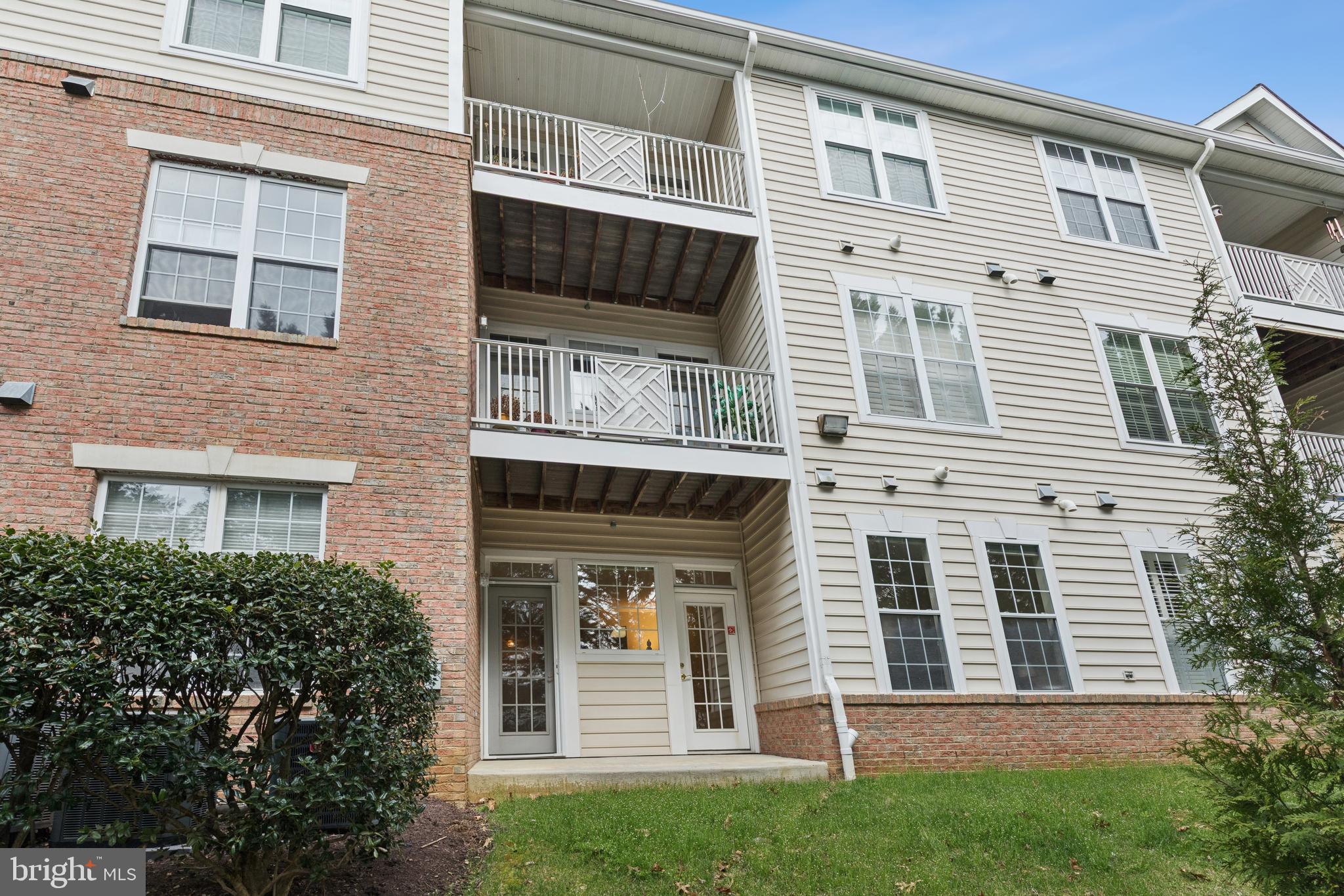 431 Hamlet Club Drive, Unit 102 Edgewater, MD 21037 - Photo 40 of 55 a view of a house with a yard