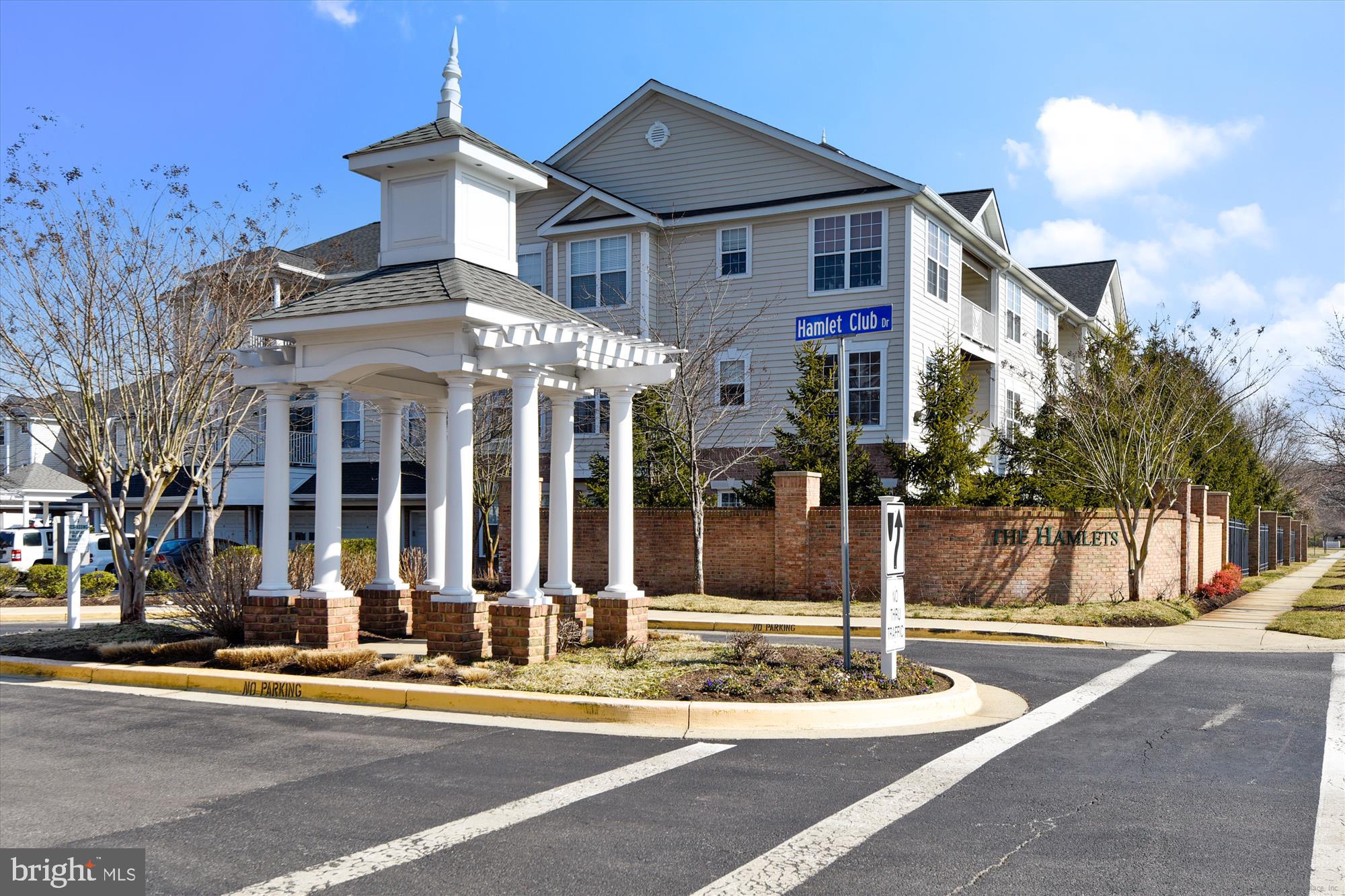 431 Hamlet Club Drive, Unit 102 Edgewater, MD 21037 - Photo 43 of 55 a front view of a house with a yard