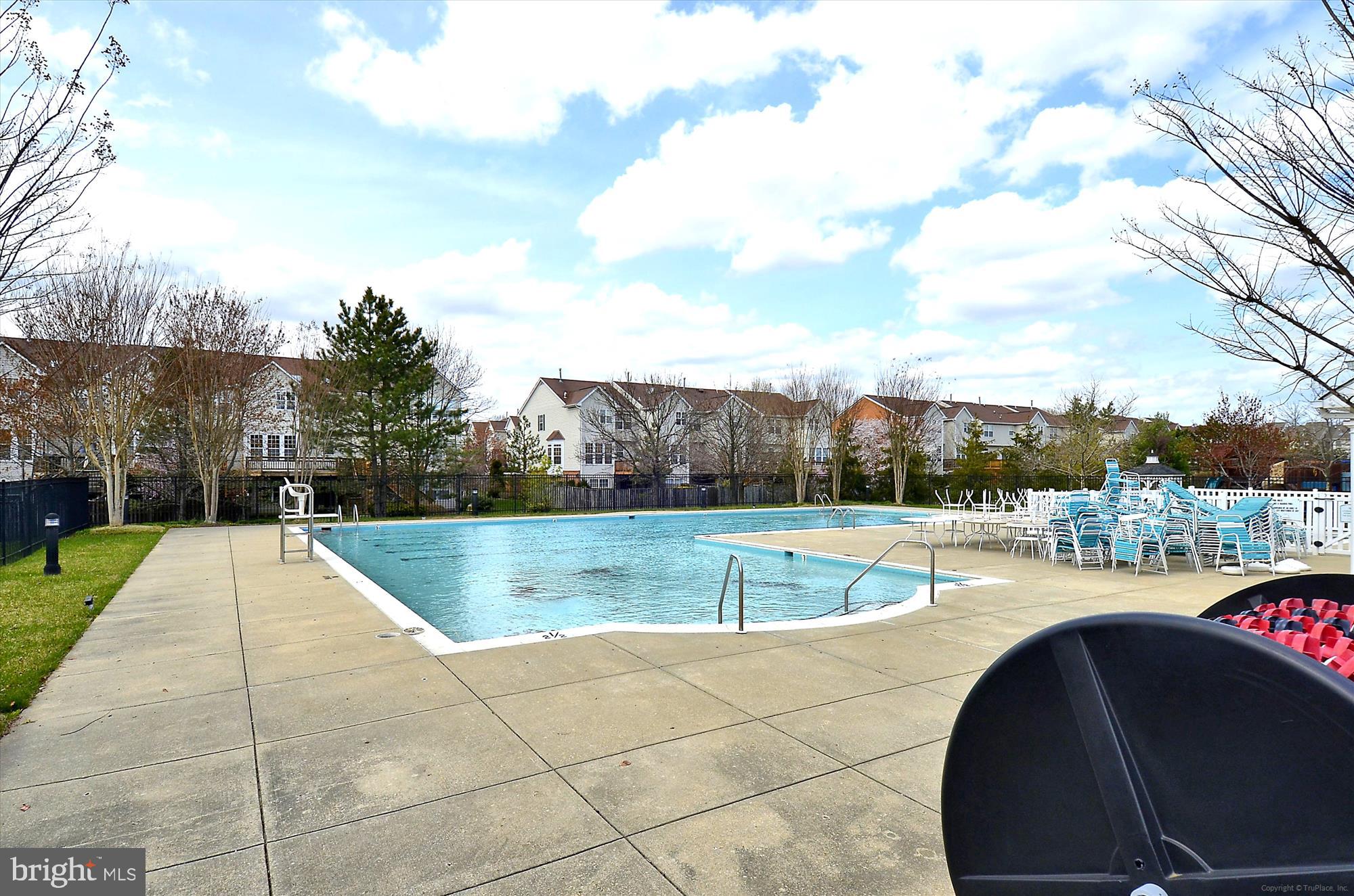 431 Hamlet Club Drive, Unit 102 Edgewater, MD 21037 - Photo 48 of 55 a view of a swimming pool with a yard