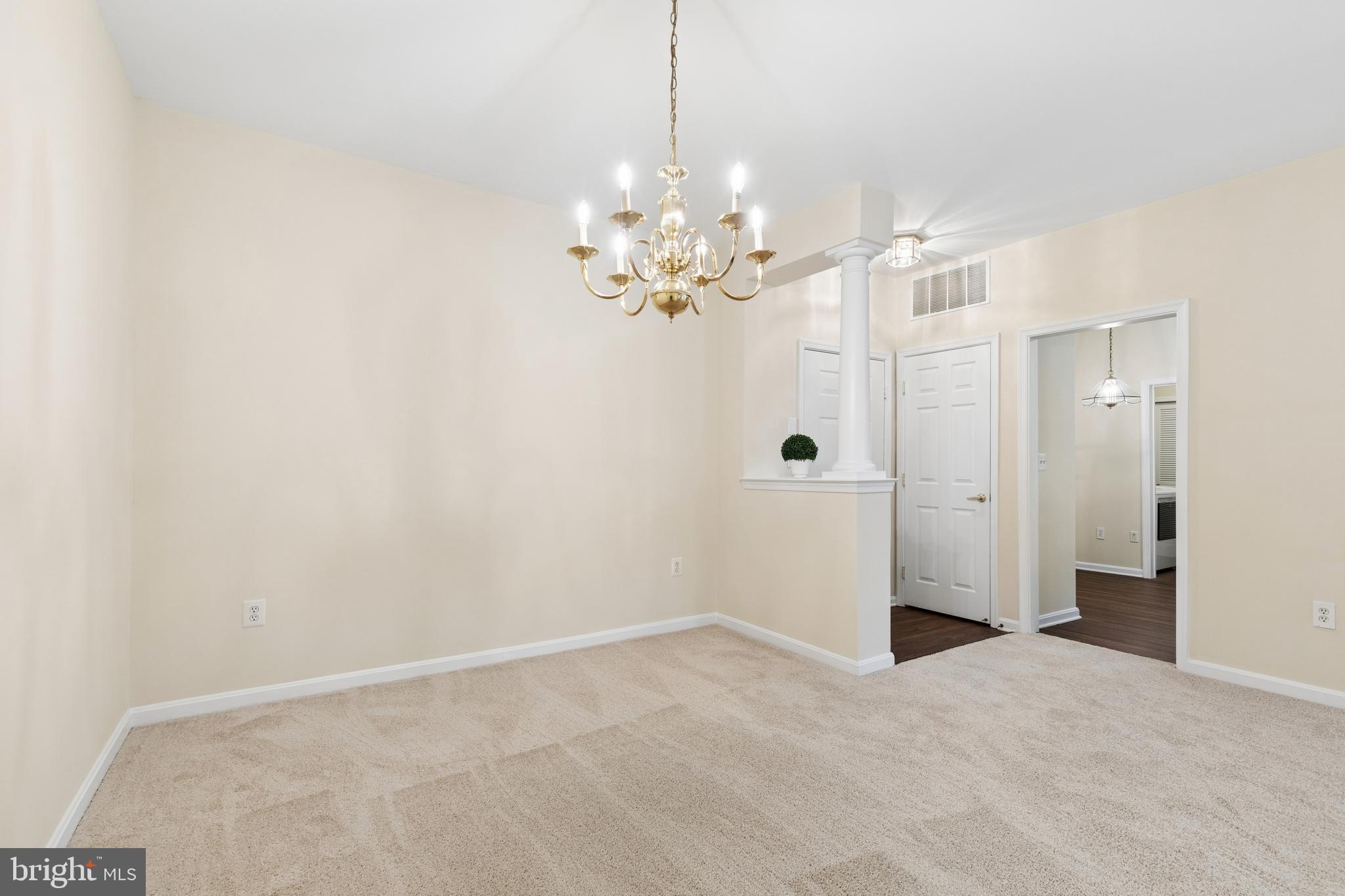 431 Hamlet Club Drive, Unit 102 Edgewater, MD 21037 - Photo 6 of 55 a view of a chandelier in a room