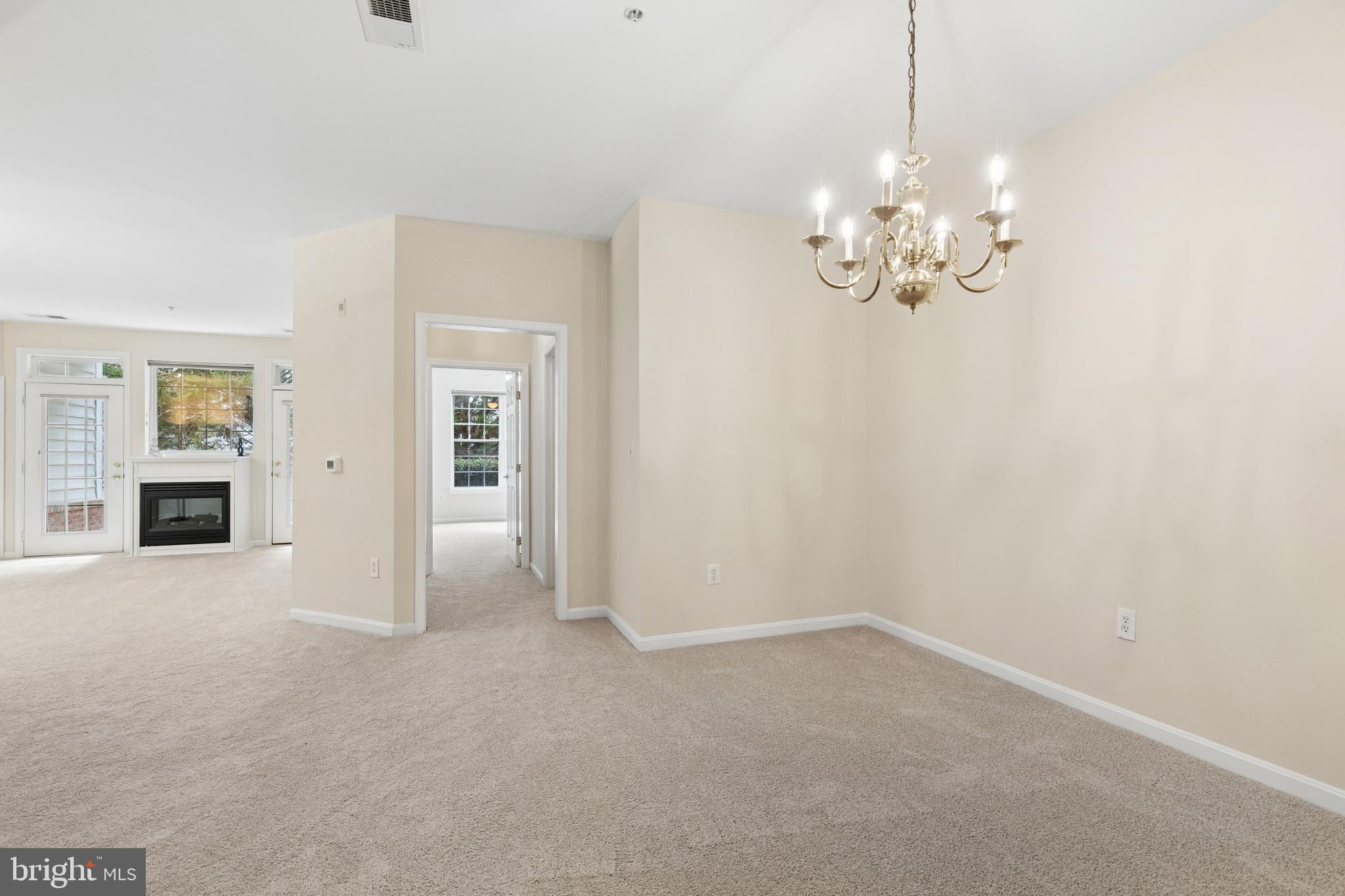 431 Hamlet Club Drive, Unit 102 Edgewater, MD 21037 - Photo 7 of 55 wooden floor in an empty room with a window