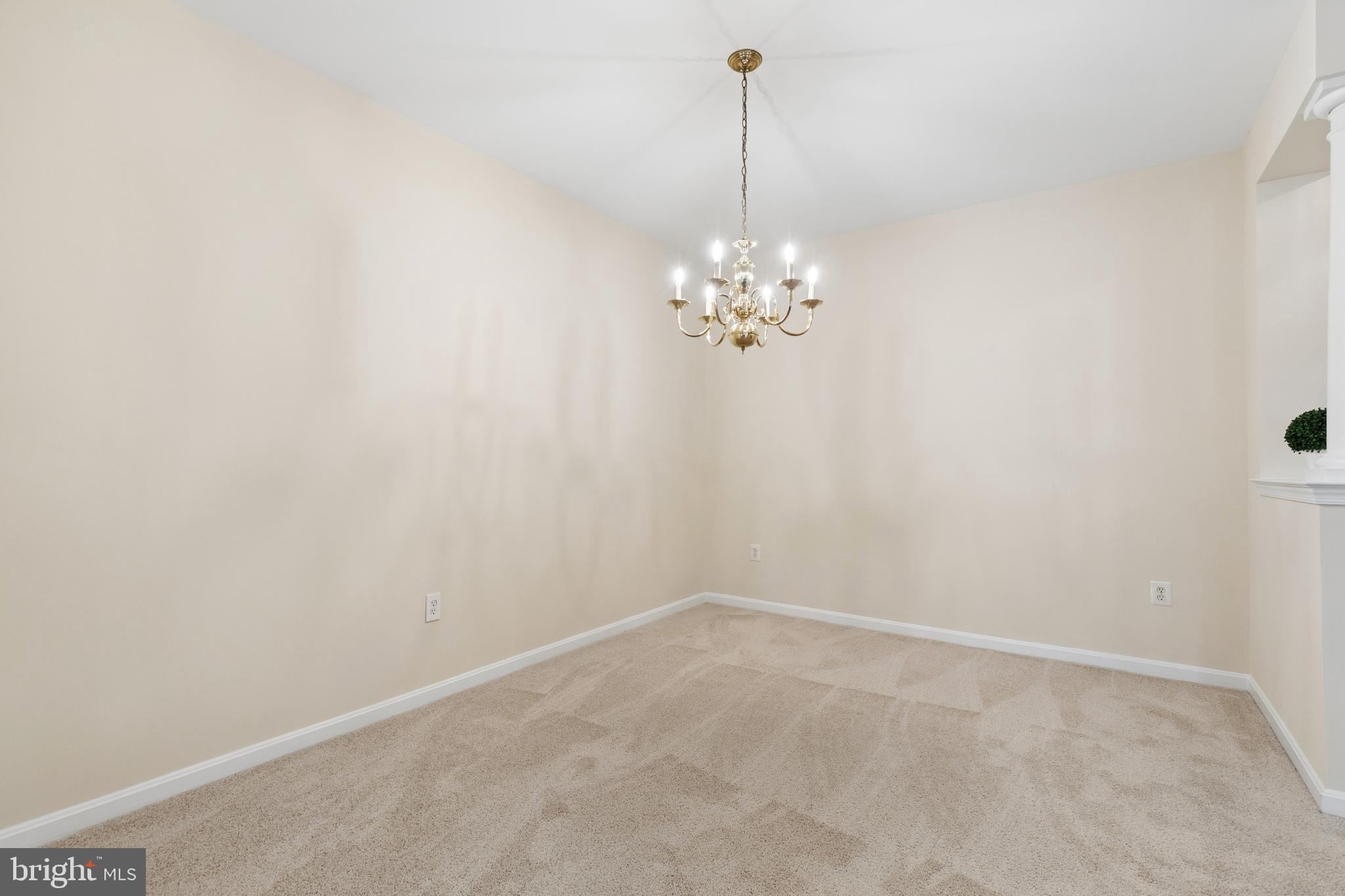 431 Hamlet Club Drive, Unit 102 Edgewater, MD 21037 - Photo 8 of 55 a view of a room with a chandelier fan