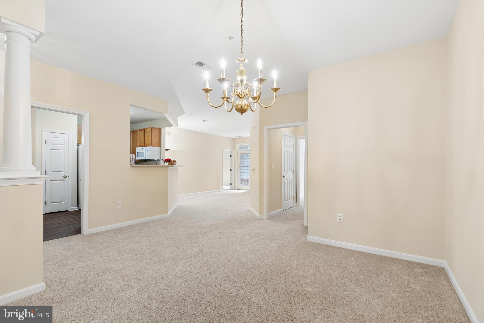 431 Hamlet Club Drive, Unit 102 Edgewater, MD 21037 - Photo 9 of 55 a view of a chandelier in big room and chandelier