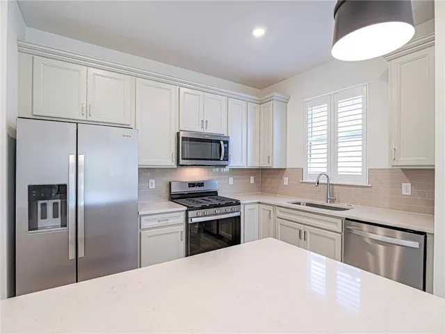a bedroom with a bed and a window with outer view