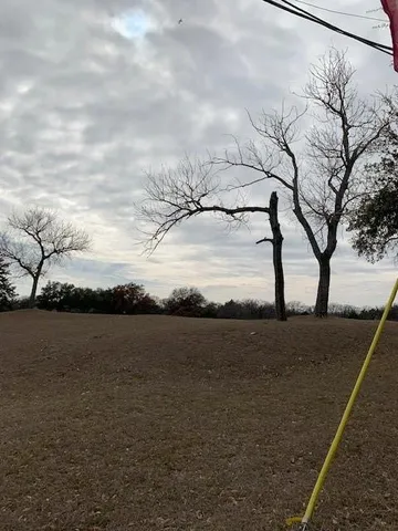 a view of a road with a building in the background