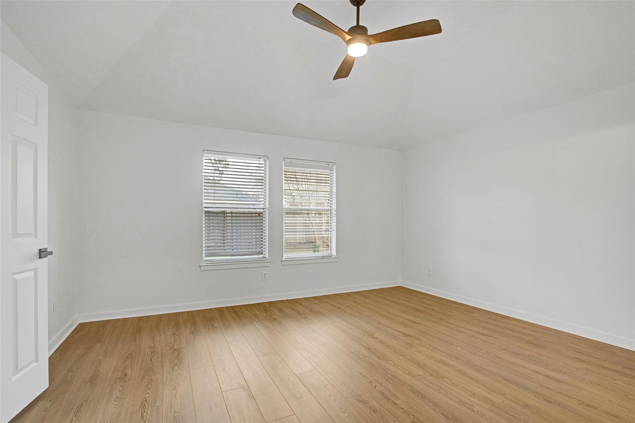 2414 Cres Hollow Court Spring, TX 77388 - Photo 20 of 37 wooden floor in an empty room with a window