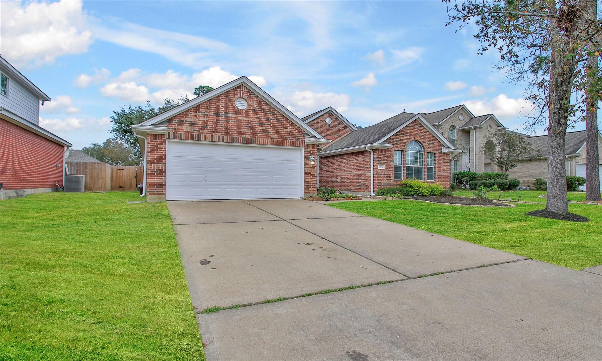 2414 Cres Hollow Court Spring, TX 77388 - Photo 2 of 37 a front view of house with yard and green space