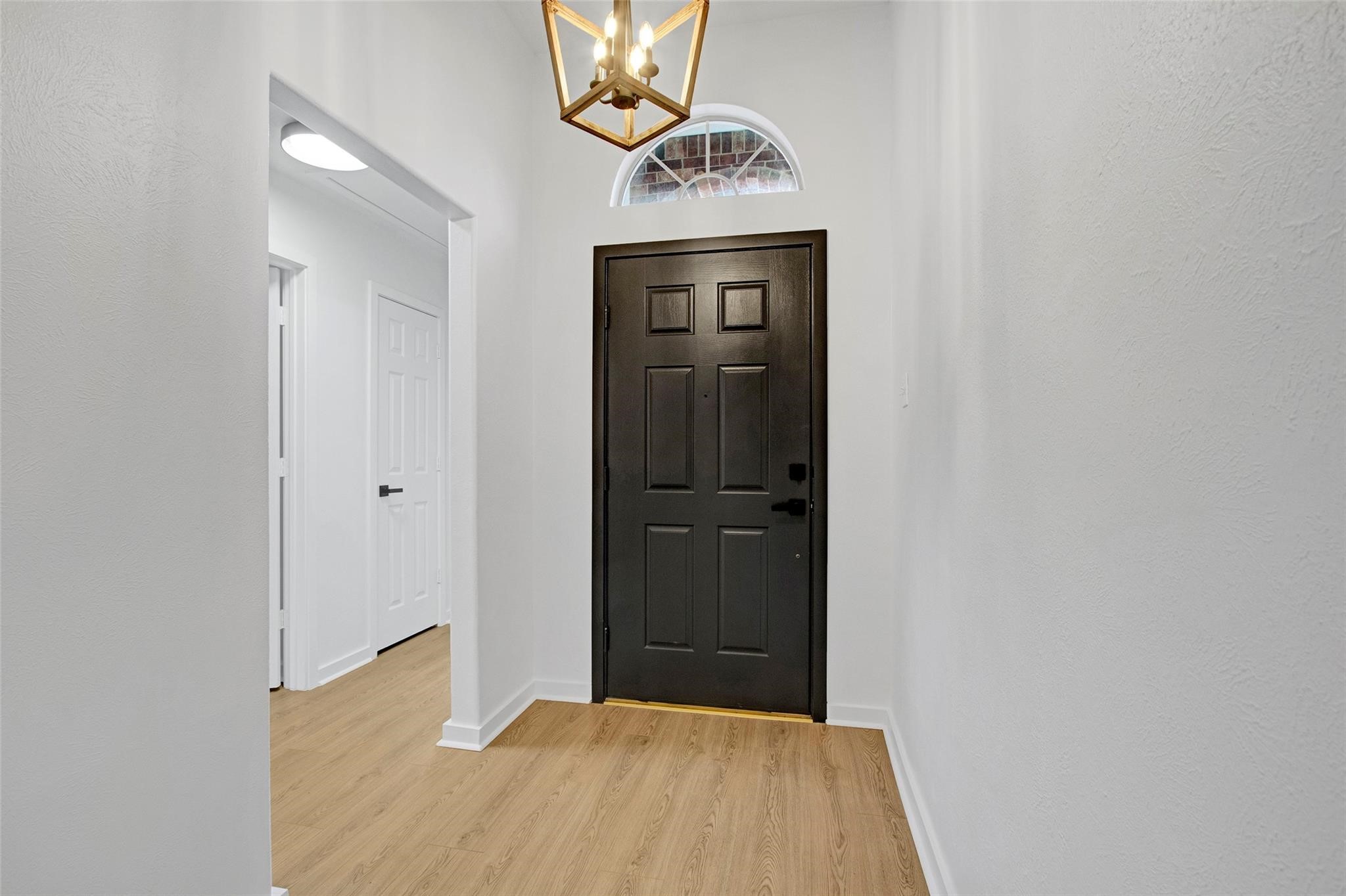 2414 Cres Hollow Court Spring, TX 77388 - Photo 7 of 37 a view of a hallway with wooden floor