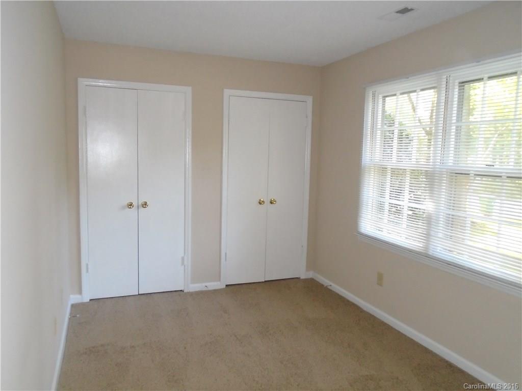6011 Trotters Ridge Road Charlotte, NC 28227 - Photo 6 of 8 a view of an empty room with a window