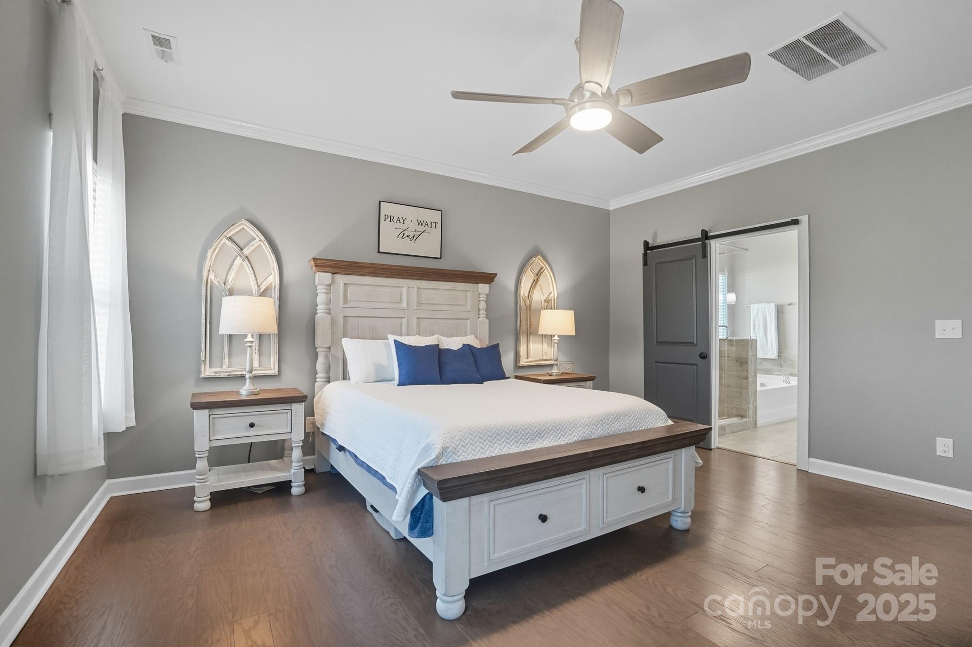 2048 Poplar Ridge Drive Monroe, NC 28110 - Photo 20 of 44 a bed room with a bed and a chandelier