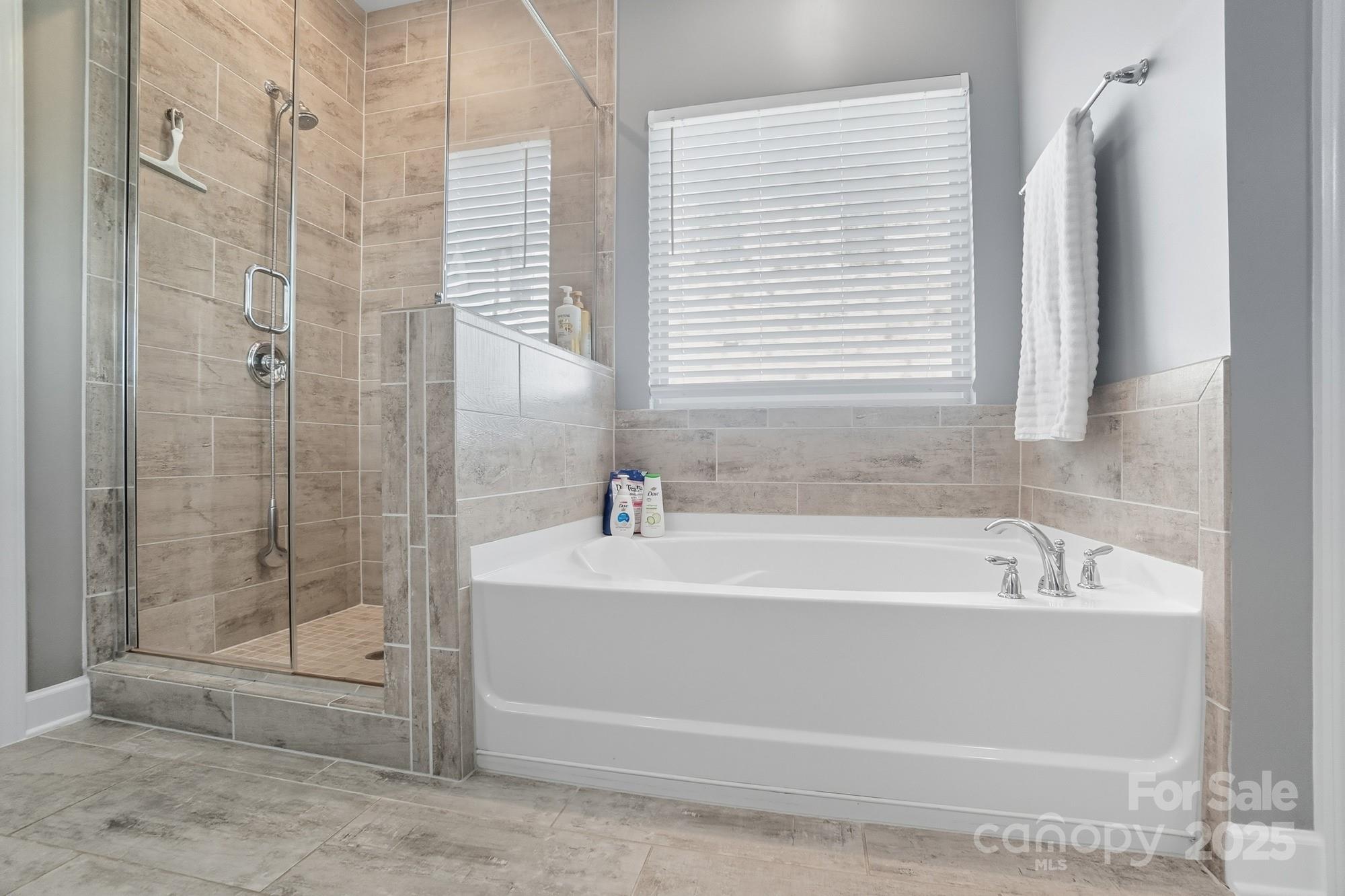 2048 Poplar Ridge Drive Monroe, NC 28110 - Photo 23 of 44 a bathroom with a bathtub and shower