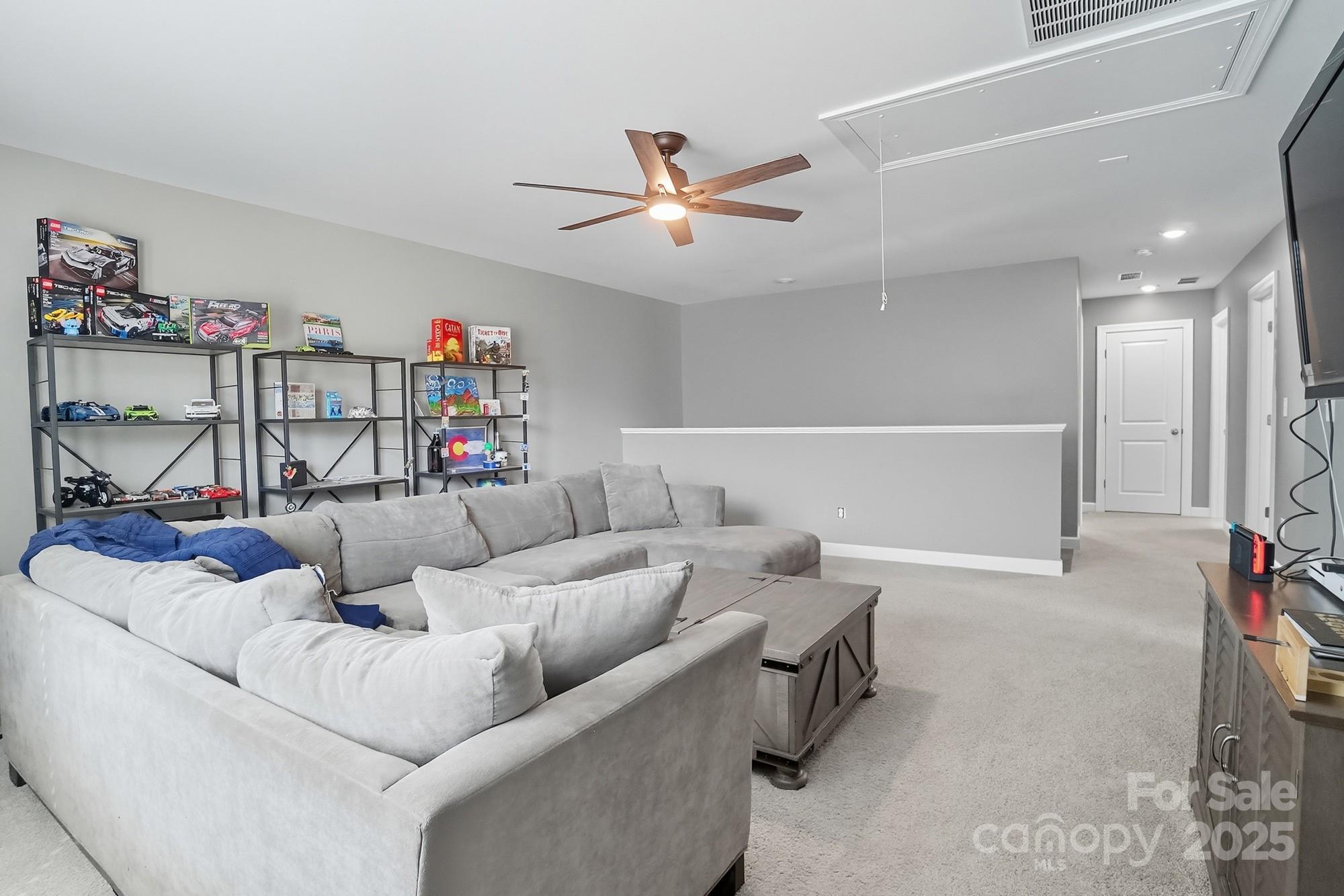 2048 Poplar Ridge Drive Monroe, NC 28110 - Photo 25 of 44 a living room with furniture and a ceiling fan