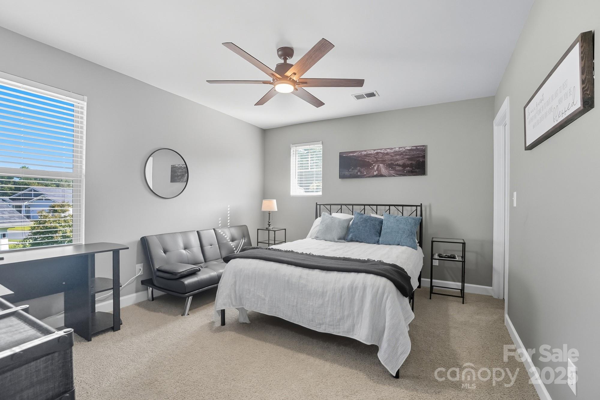 2048 Poplar Ridge Drive Monroe, NC 28110 - Photo 28 of 44 a spacious bedroom with a bed and a window