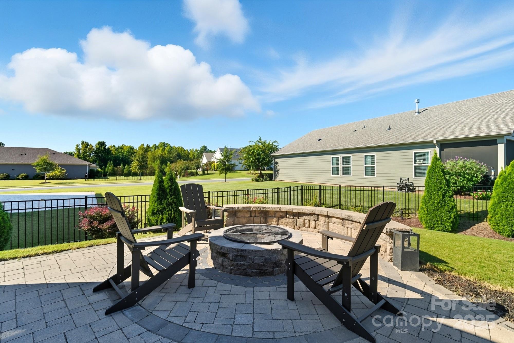 2048 Poplar Ridge Drive Monroe, NC 28110 - Photo 37 of 44 a roof deck with table and chairs and potted plants