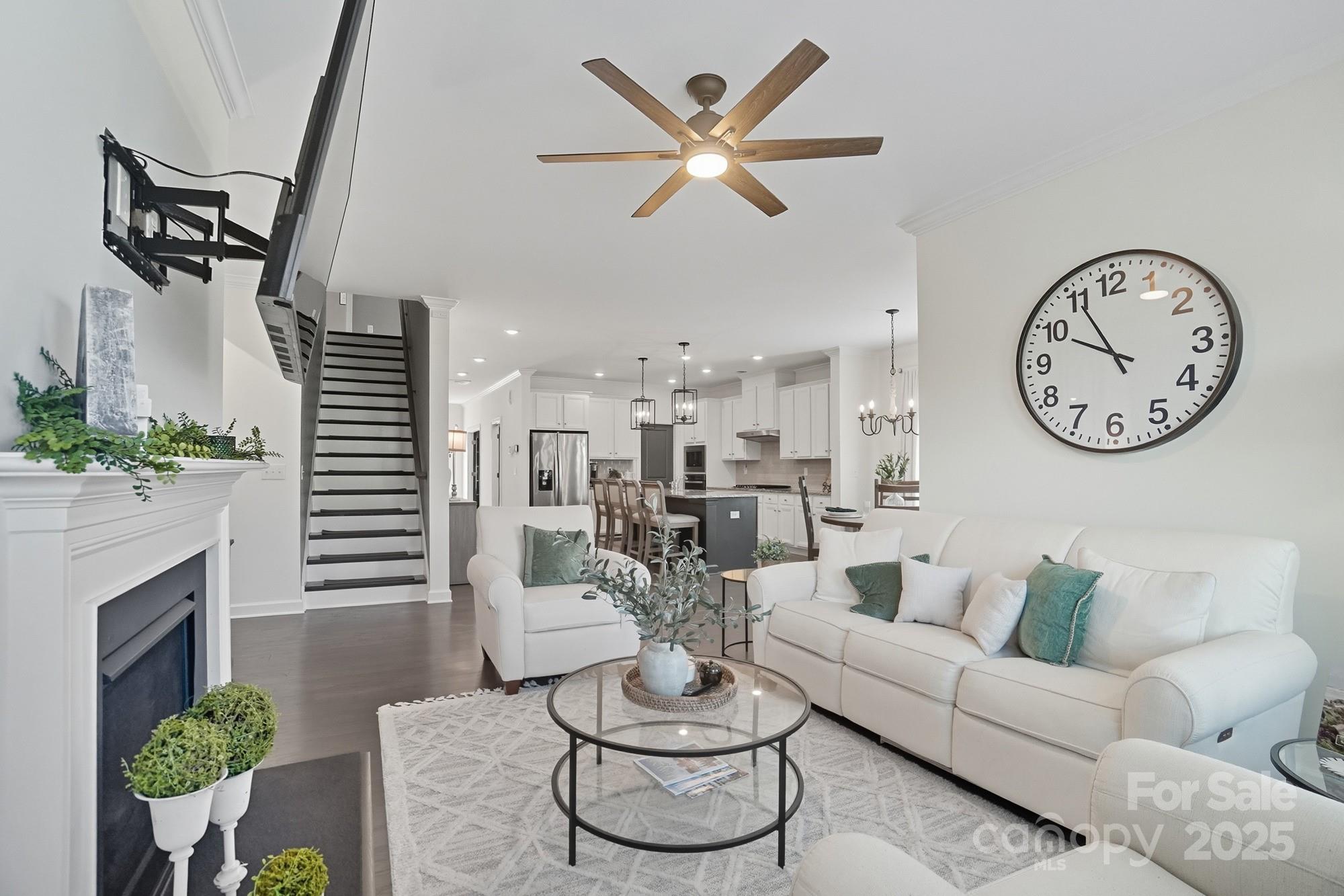 2048 Poplar Ridge Drive Monroe, NC 28110 - Photo 6 of 44 a living room with furniture potted plant and a fireplace