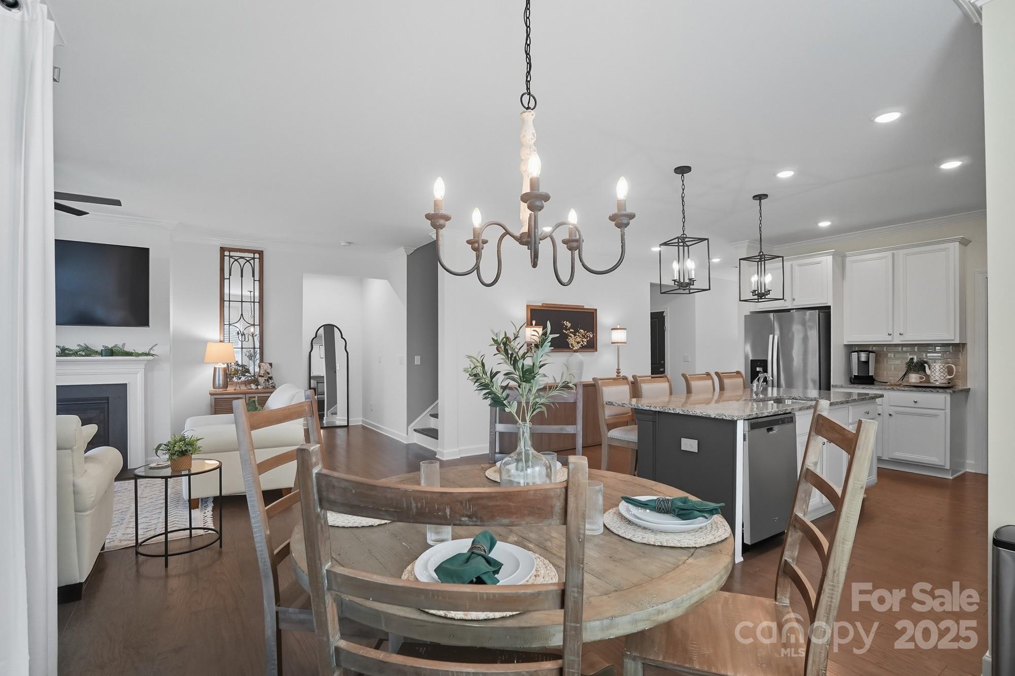 2048 Poplar Ridge Drive Monroe, NC 28110 - Photo 7 of 44 a room with stainless steel appliances kitchen island granite countertop furniture and a fireplace