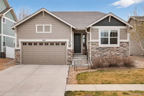 a front view of a house with garage