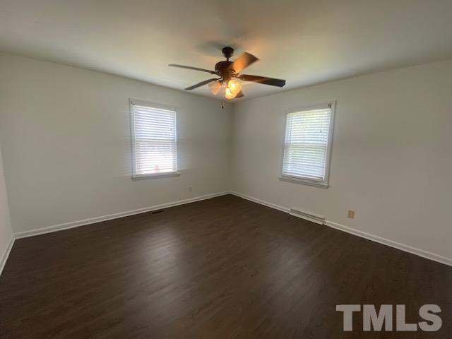 200 South 11th Street Erwin, NC 28339 - Photo 11 of 20 a view of an empty room with a window