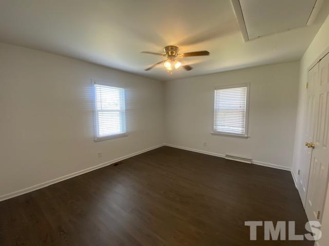 200 South 11th Street Erwin, NC 28339 - Photo 14 of 20 a view of an empty room with a window