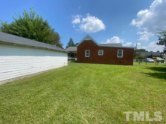 200 South 11th Street Erwin, NC 28339 - Photo 16 of 20 a view of a house with a yard
