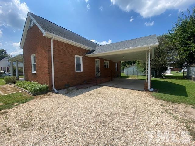 200 South 11th Street Erwin, NC 28339 - Photo 20 of 20 a view of a house with backyard and garden