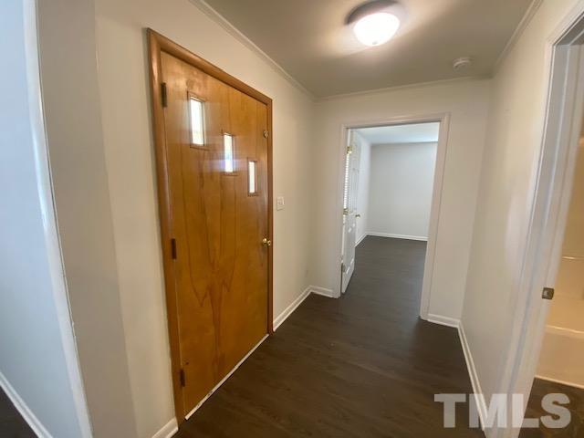 200 South 11th Street Erwin, NC 28339 - Photo 6 of 20 a view of a hallway with wooden floor