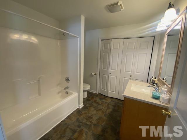 200 South 11th Street Erwin, NC 28339 - Photo 7 of 20 a bathroom with a bathtub and a sink