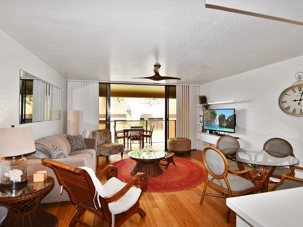 1661 Pee Road, Unit I303 Koloa, HI 96756 - Photo 4 of 15 a living room with furniture and a large window