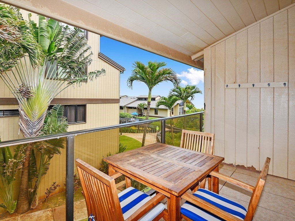 1661 Pee Road, Unit I303 Koloa, HI 96756 - Photo 5 of 15 a bedroom with furniture and a large window