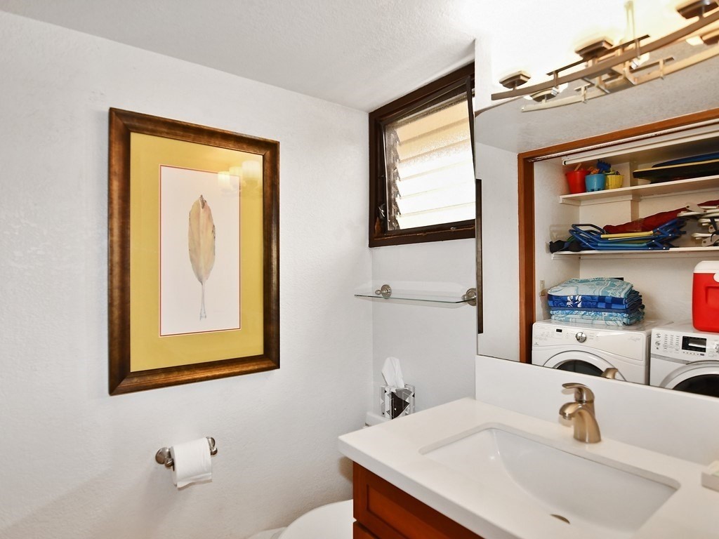 1661 Pee Road, Unit I303 Koloa, HI 96756 - Photo 9 of 15 a bathroom with a sink and a mirror