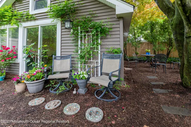 a wooden bench sitting in front of a house