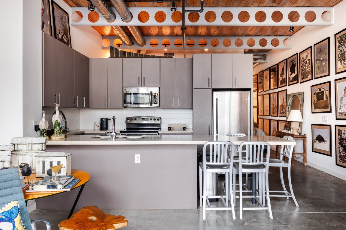 The kitchen provides a warm industrial design.