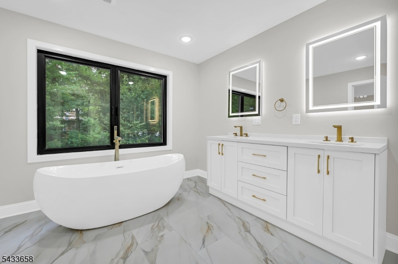 2 Orchard Road Florham Park, NJ 07932 - Photo 22 of 23 a bathroom with a bathtub sink and mirror