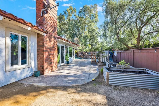 a view of a backyard with sitting area