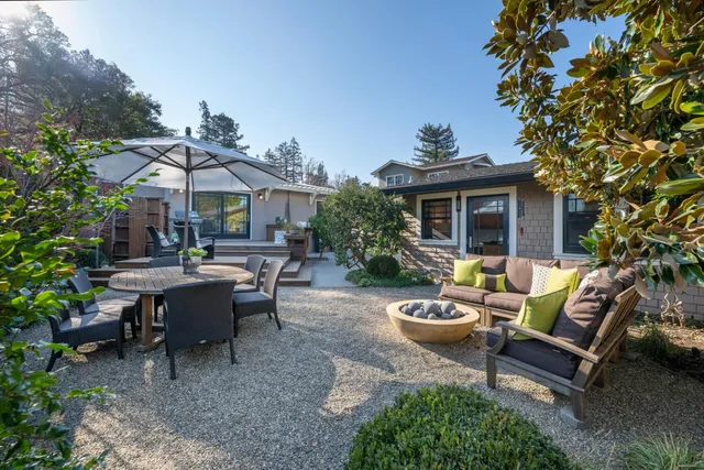 a view of a patio with a chairs and table in a patio