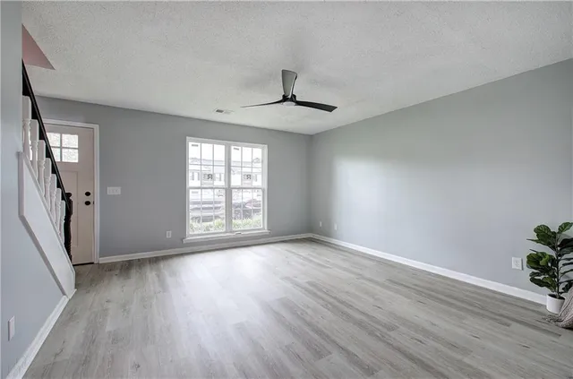 a view of an entryway with wooden floor