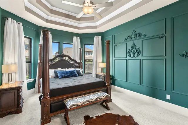 a living room with furniture chandelier and a wooden floor