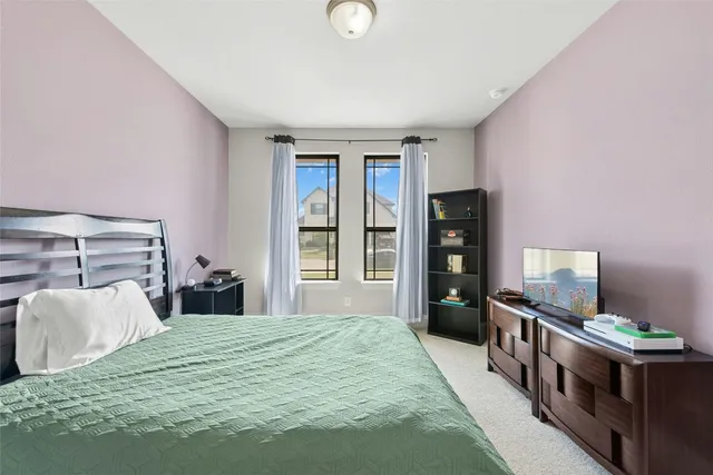 a white bath tub sitting in a bathroom with a bathtub and a mirror