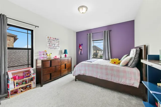 a bathroom with a bathtub sink and mirror