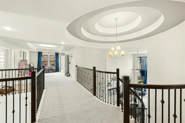 a view of a livingroom with furniture and chandelier