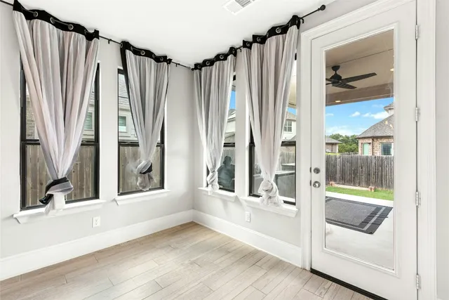 a kitchen with stainless steel appliances granite countertop a sink and a stove
