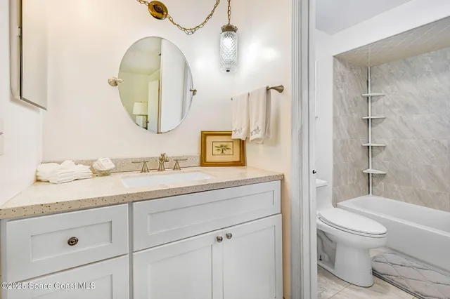 a bedroom with a bed and a chair