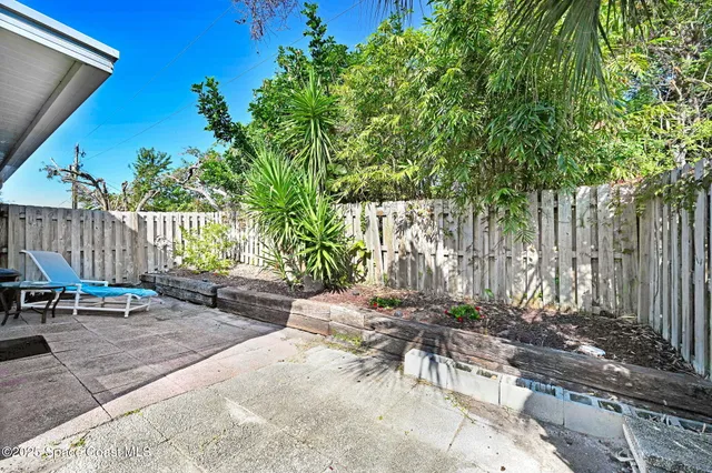 a view of a work space with furniture and wooden floor
