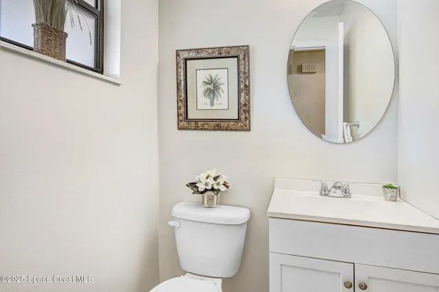 a living room with furniture and stairs