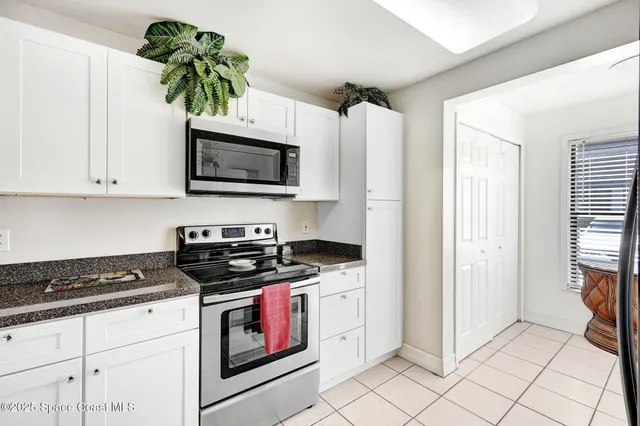 a room with a refrigerator and window