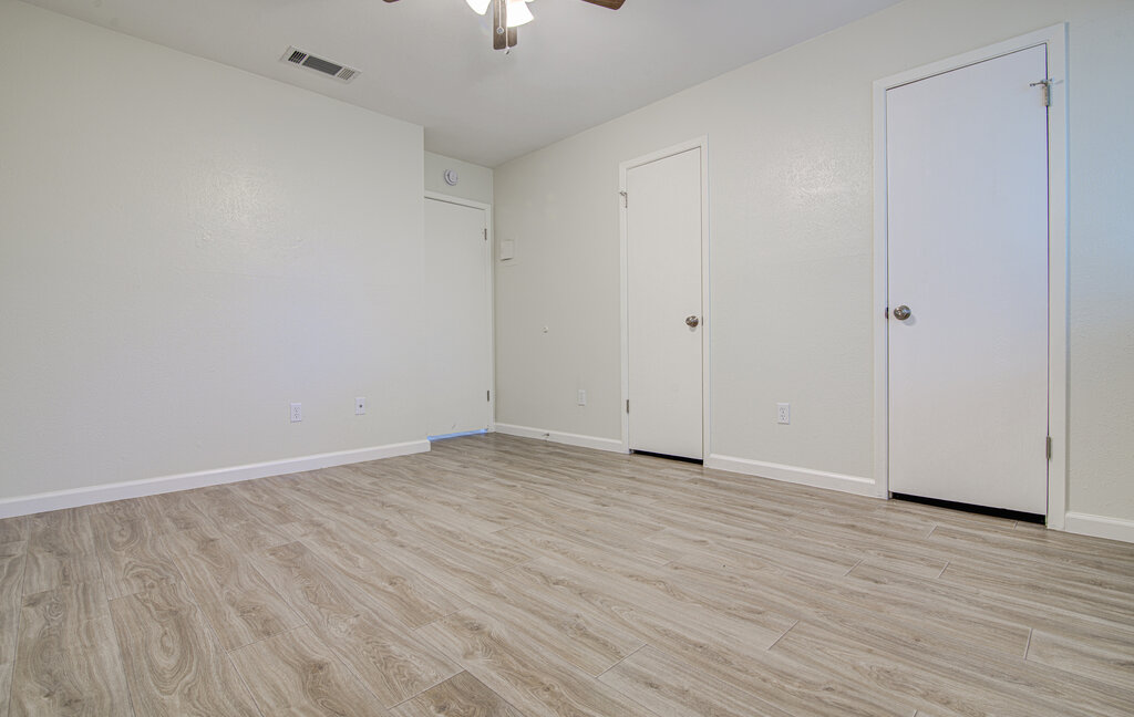 5301 Indio Circle, Unit A Austin, TX 78745 - Photo 16 of 25 Laminate flooring and crisp white walls define this well-kept living space.