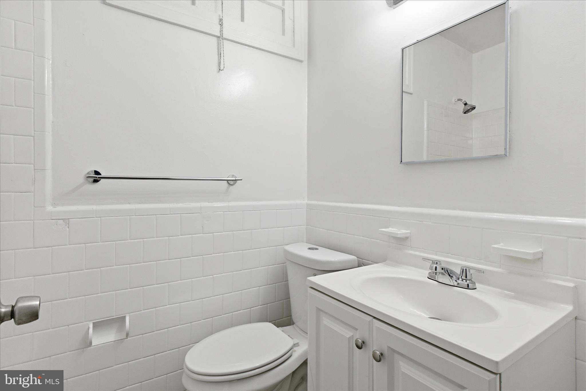 221 20th Street Northeast, Unit 4 Washington, DC 20002 - Photo 27 of 30 a bathroom with a sink a toilet and shower