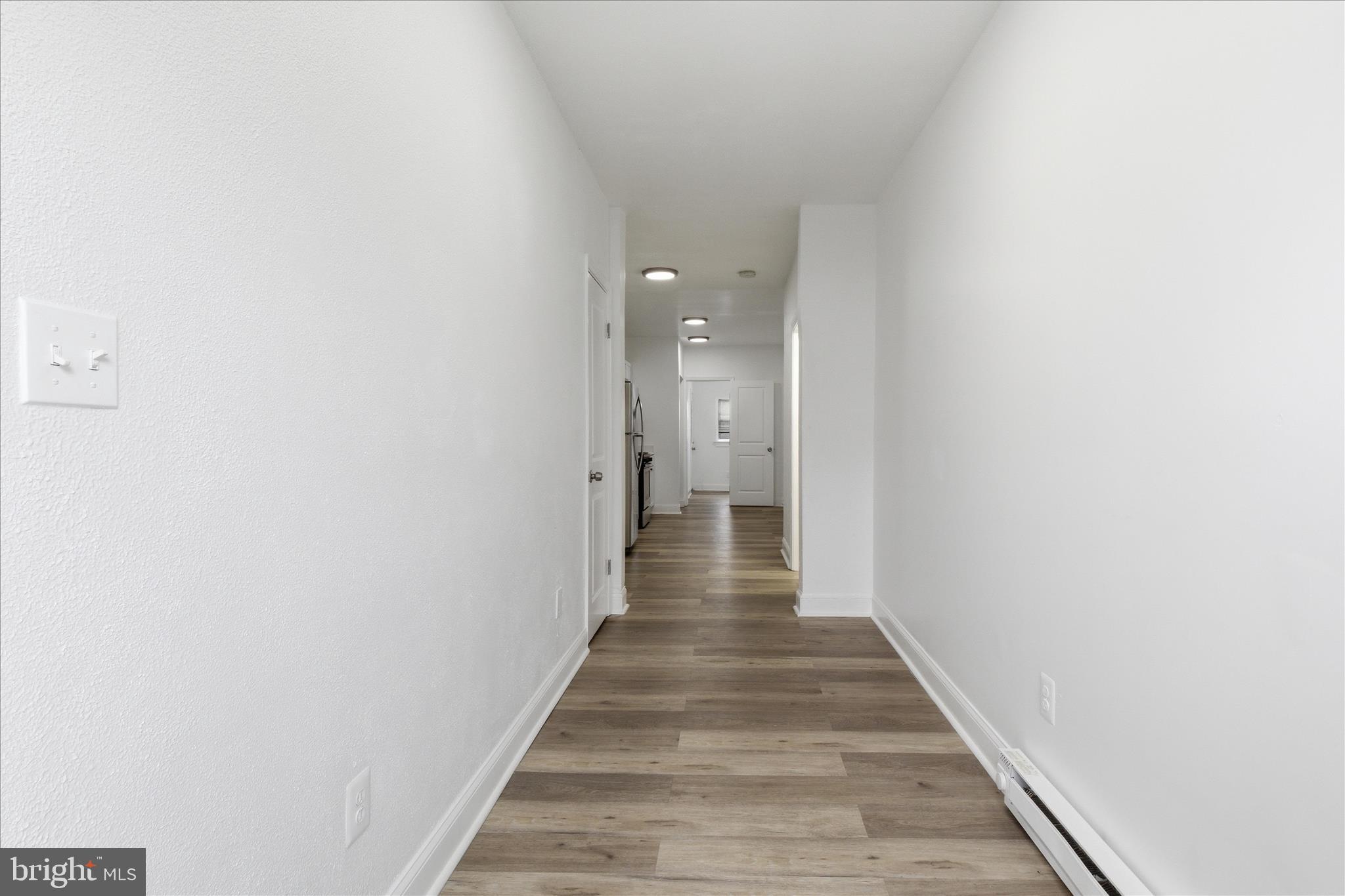 221 20th Street Northeast, Unit 4 Washington, DC 20002 - Photo 4 of 30 a view of a hallway with wooden floor