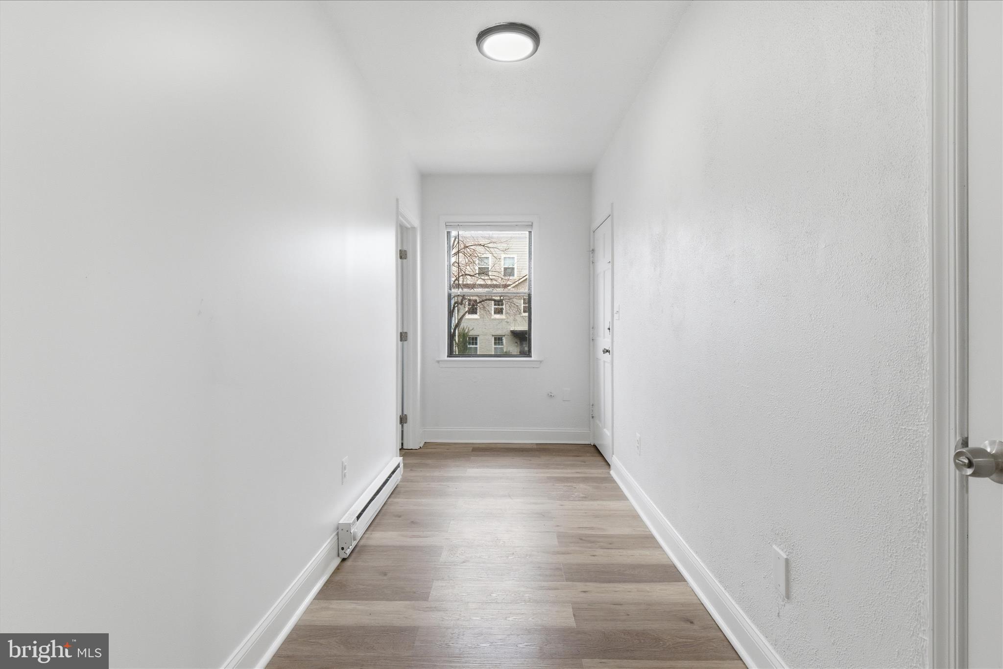 221 20th Street Northeast, Unit 4 Washington, DC 20002 - Photo 6 of 30 a view of an empty room with windows